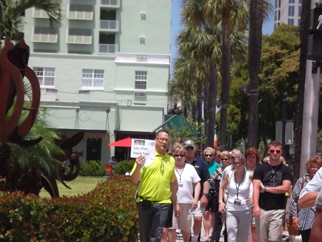 A group of people walking down the street