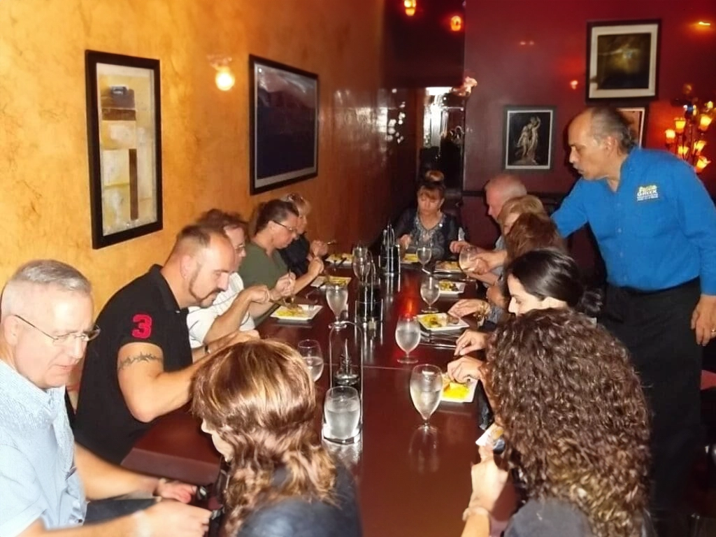 Group of people dining at a restaurant.